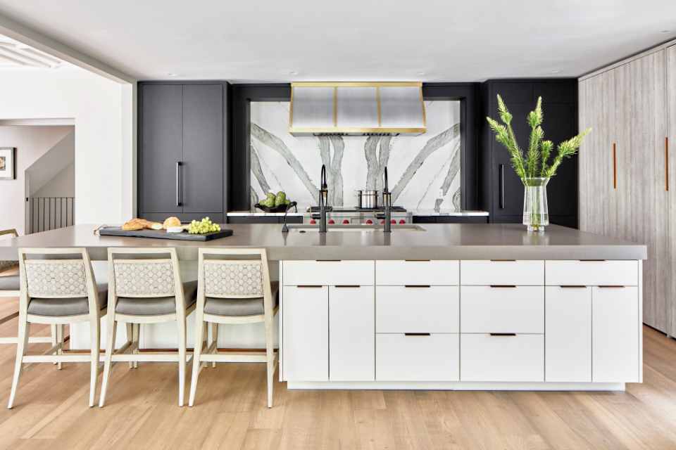 designer kitchen in modern home with custom oven backsplash